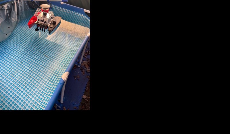 Twin-hull autonomous surface vehicle with GPS receiver and sensor array in a test pool